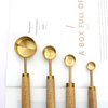 measuring spoon with wooden handle