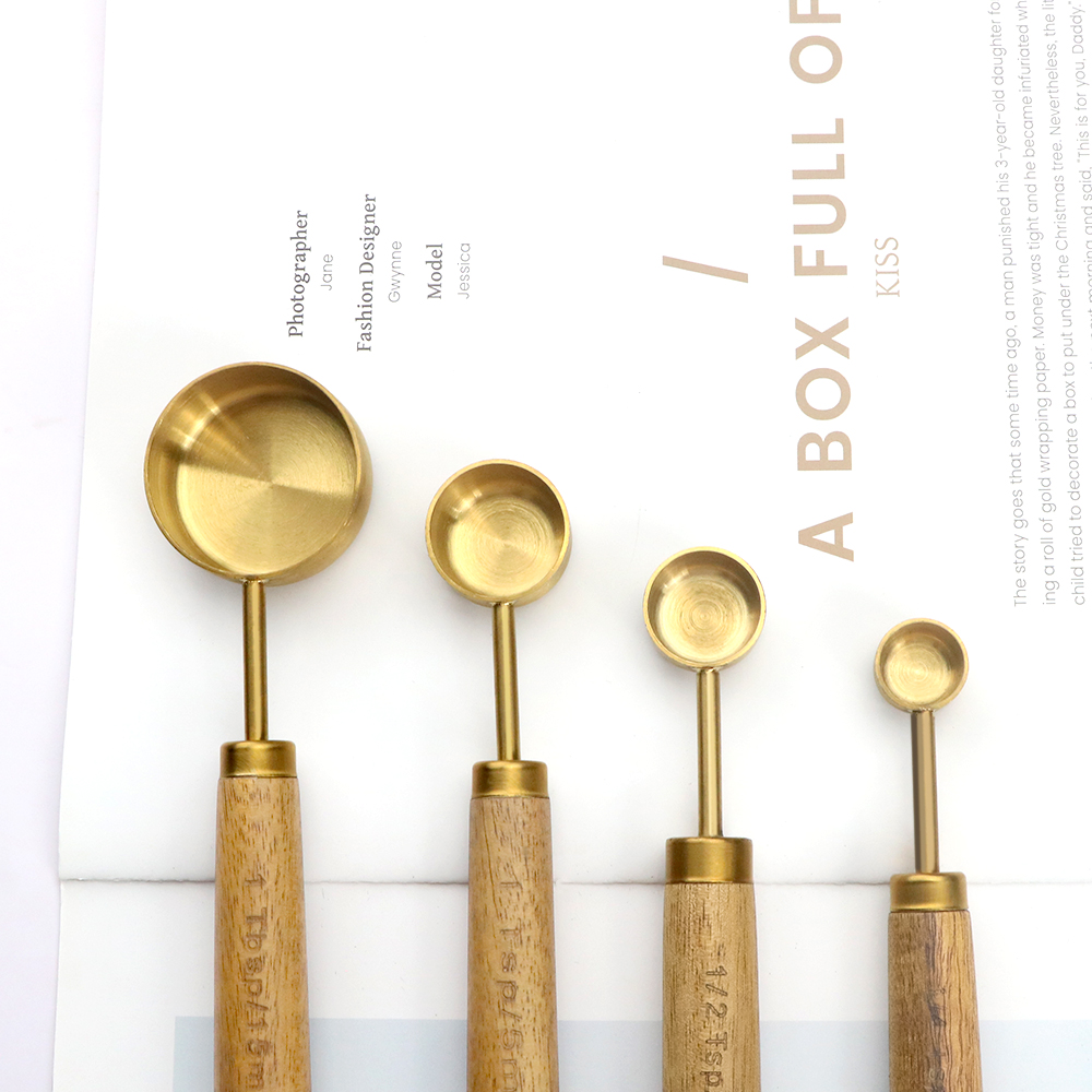 measuring spoon with wooden handle