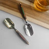 Stainless steel spoon with wooden handle