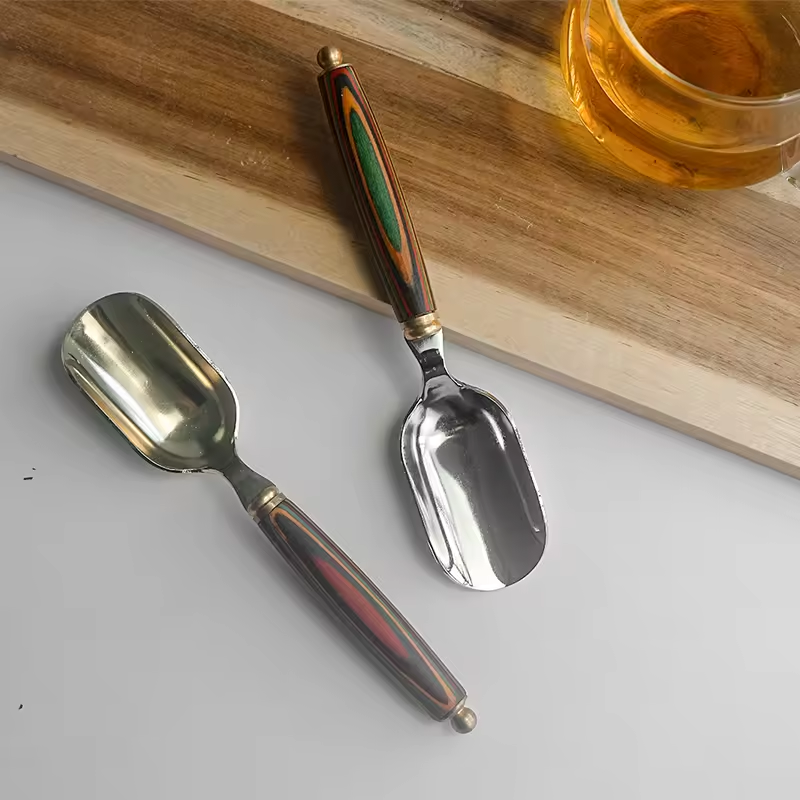 Stainless steel spoon with wooden handle